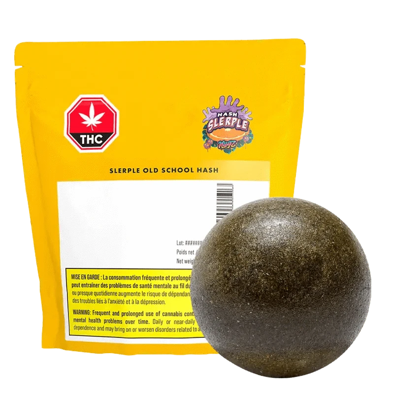 A close-up of the G Sherb Old School Traditional Hash, displaying a beige block with black lettering against a dark backdrop.