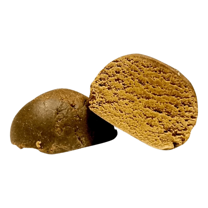 Close-up view of the dark brown O.G. Hash, displaying its textured, rounded shape against a plain white background.
