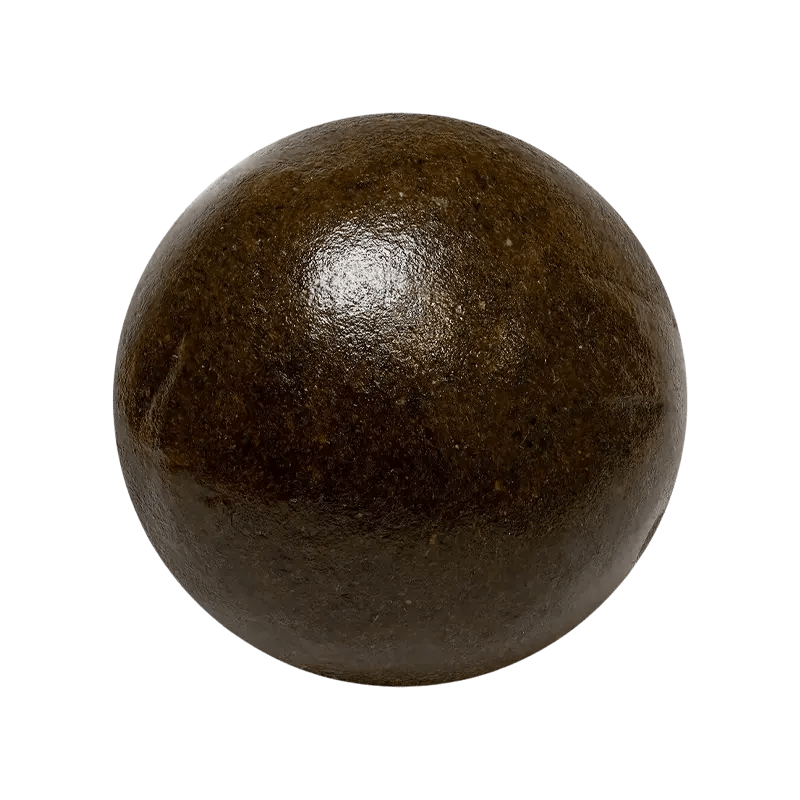 A close-up, top-down view of the Slapz Ice Water Hash, a dark, circular substance resembling a pressed pellet.