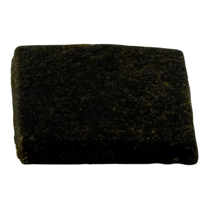 Close-up, top-down view of the Smokehouse Hash, showing a dark, textured material against a plain white background.