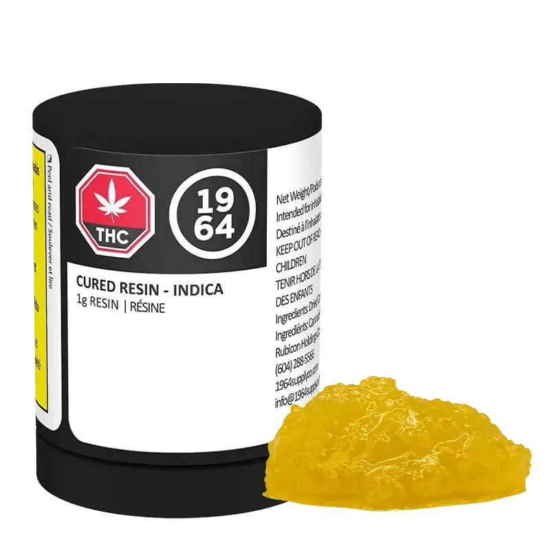 Front view of the Indica Cured Resin container with a red and white label, showcasing visible text and a leaf graphic.
