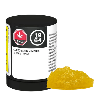 Front view of the Indica Cured Resin container with a red and white label, showcasing visible text and a leaf graphic.
