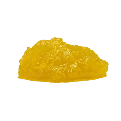 A close-up view of the golden, textured Indica Cured Resin, softly lit against a plain white background.