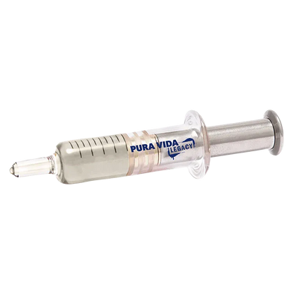 Angled close-up of a clear syringe-style dispenser labeled "Strawberry Gush Live Resin Jumbo Dispenser" lying on a white background.