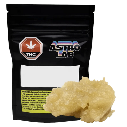 A close-up of the Astro Cold Cured Rosin packaging features bold branding with a cannabis leaf symbol against a dark background.