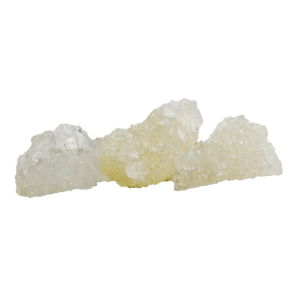 Close-up of crystallized Black Cherry Punch Diamonds with a translucent, jagged texture against a plain white background.