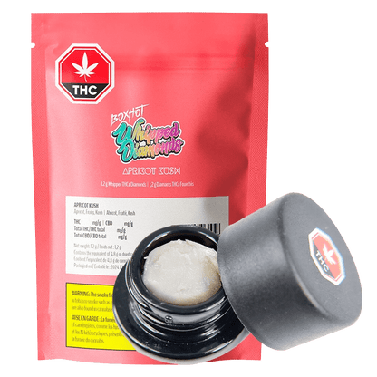 Close-up of Apricot Kush Diamonds, showing a branded package with the product name prominently displayed in a modern design.