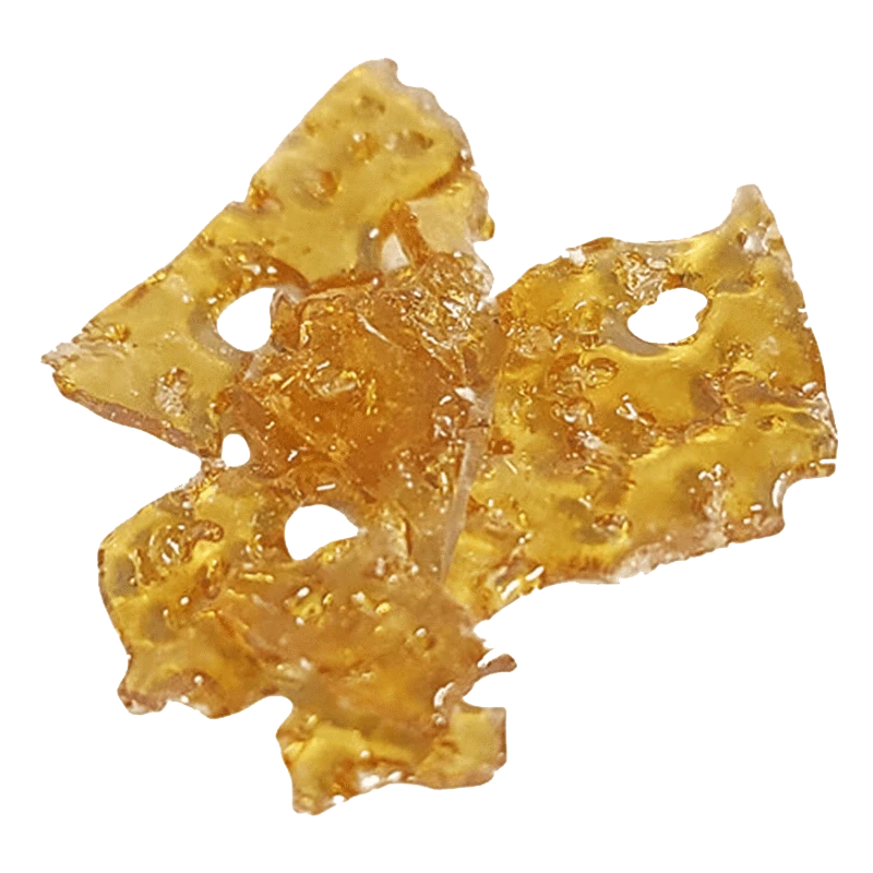A close-up, overhead view of the golden Grape Animal Shatter 2.0, showing its fragmented, crystalline texture.