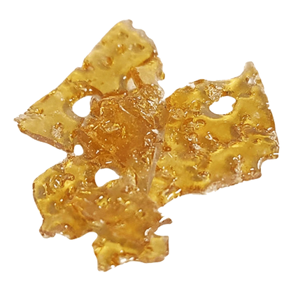 A close-up, overhead view of the golden Grape Animal Shatter 2.0, showing its fragmented, crystalline texture.