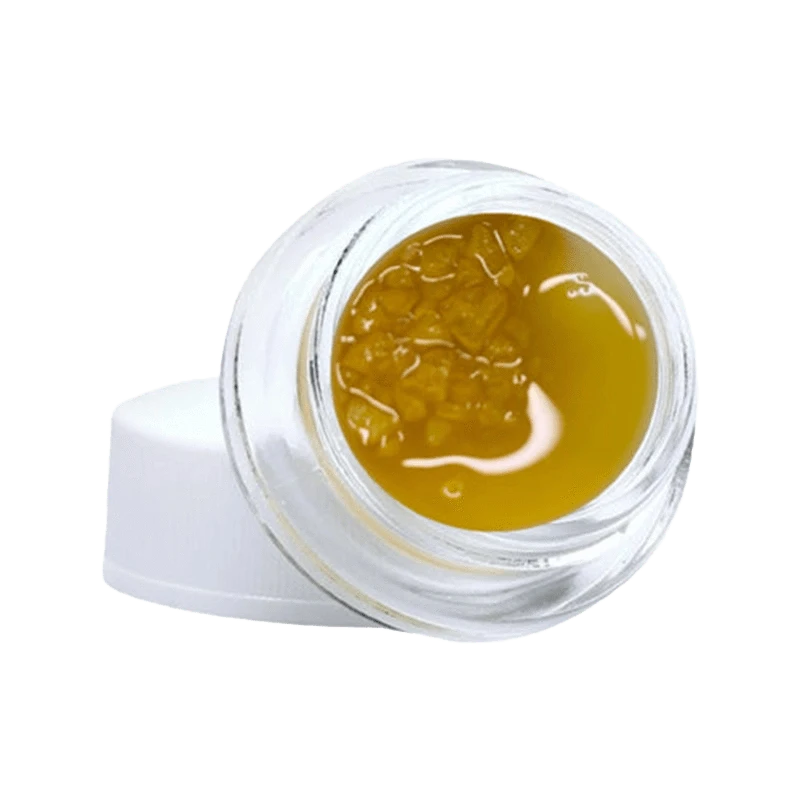 Close-up of the Gelato #33 Diamonds & Terp Sauce with a golden, viscous texture visible within a clear container.