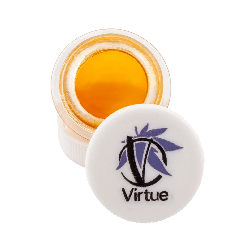 Close-up of Orange Bud Terp Sauce in a clear jar, displaying its golden hue and viscous texture.