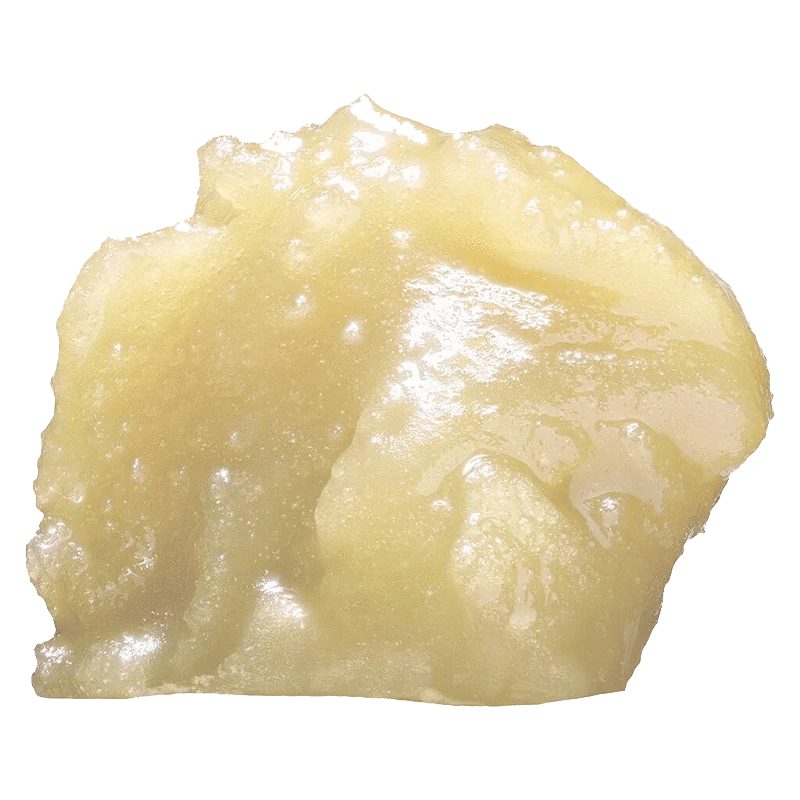 Close-up of the Naked Live Diamond Hash, showing a textured, golden-brown substance against a plain white background.