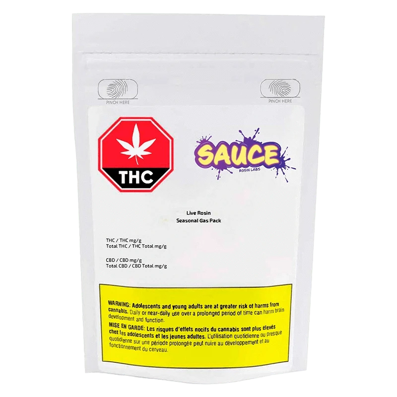 A close-up of the Live Rosin Seasonal Gas Pack packaging with a warning label and branding, viewed from a slightly angled perspective.