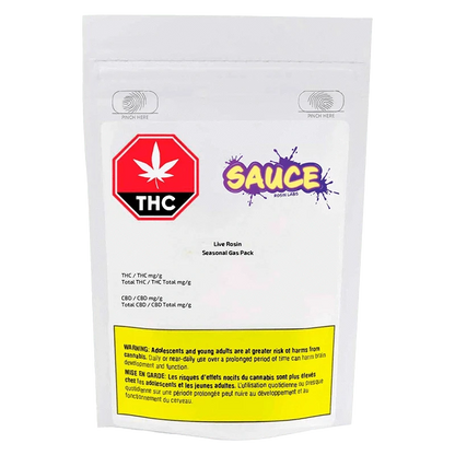 A close-up of the Live Rosin Seasonal Gas Pack packaging with a warning label and branding, viewed from a slightly angled perspective.