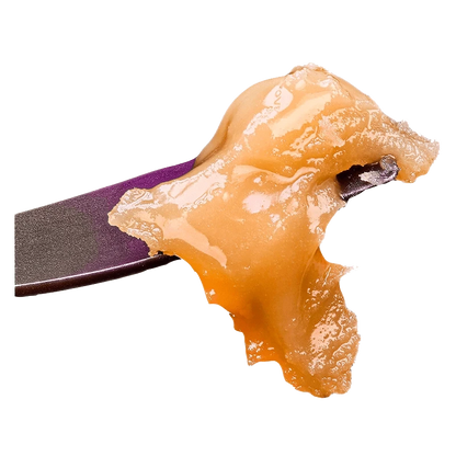 A close-up, angled view of the Live Rosin Seasonal Gas Pack, showcasing its amber color and textured surface.