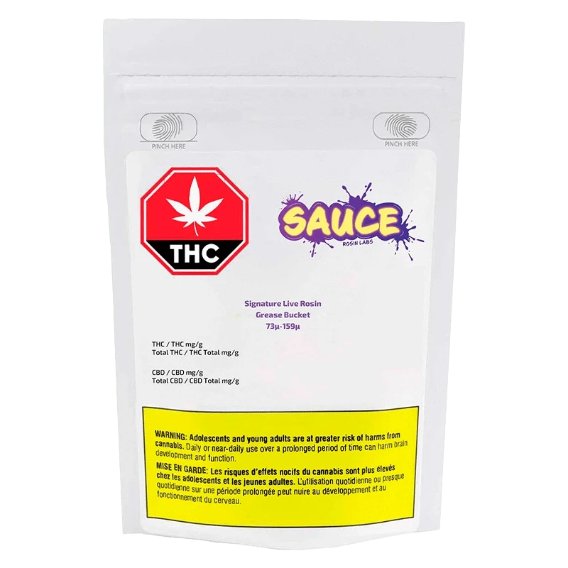 Front view of the Grease Bucket Signature Live Rosin packaging with THC warnings and a dark background.