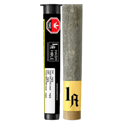 Close-up of the Hash Hole Infused Pre Rolled 2 x 1 g packaging, displaying a warning symbol against a black background.