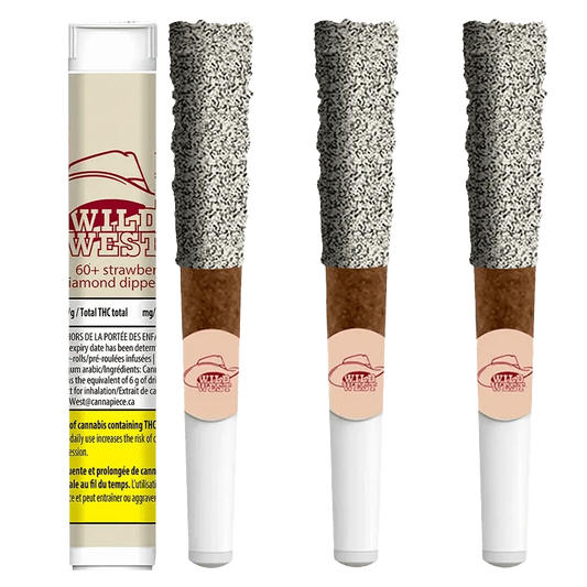 A close-up of the 60+ Strawberry Stampede Diamonds Dipped Infused Blunts packaging against a black background.