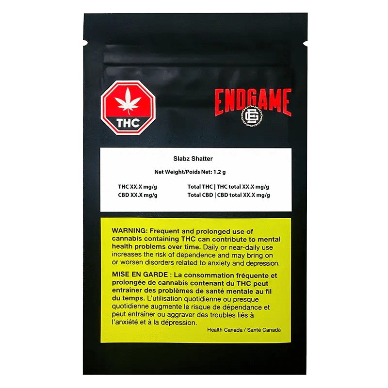 Front view of Endgame Slabz Shatter packaging with bold text and a cannabis leaf against a dark, gradient background.