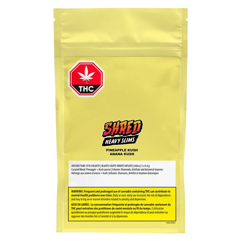 Front view of a yellow pouch labeled "Pineapple Kush Heavy Slims Infused PR 5 x 0.4 g" with a red THC stop-sign logo and bold "SHRED Heavy Slims" text centered.
