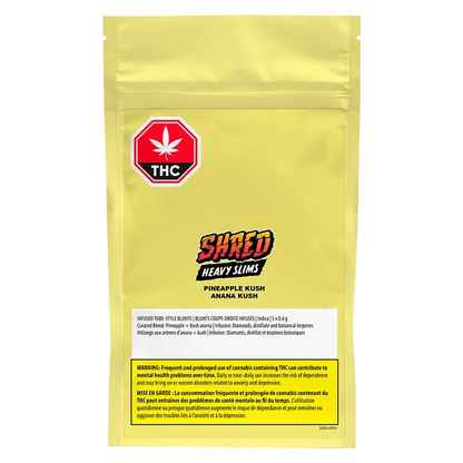 Front view of a yellow pouch labeled "Pineapple Kush Heavy Slims Infused PR 5 x 0.4 g" with a red THC stop-sign logo and bold "SHRED Heavy Slims" text centered.