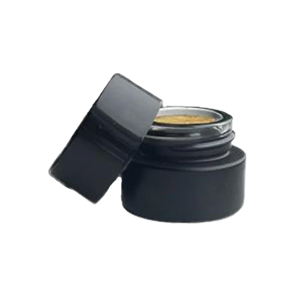 Angled close-up of an open black jar of golden concentrate labeled G.A.S. Rosin, lid resting against the side.