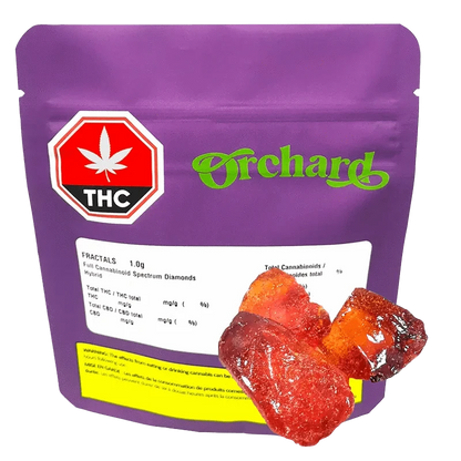 Front-facing shot of a purple pouch labeled Orchard containing Fractals Full Cannabinoid Spectrum Diamond with glossy red-orange crystalline pieces in front.