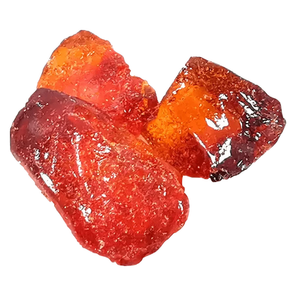 Close-up of three glossy red-orange resin chunks on a white background, shown as Fractals Full Cannabinoid Spectrum Diamond.