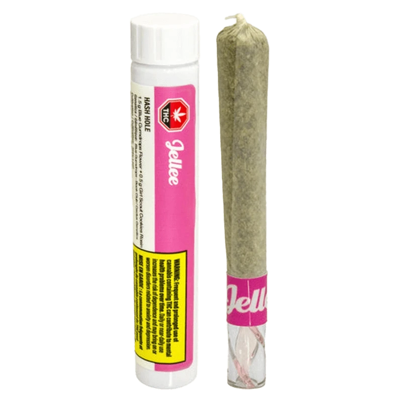 Straight-on view of a pre-rolled joint standing next to its white and pink tube labeled "Hash Hole Infused PR 1 x 2 g."