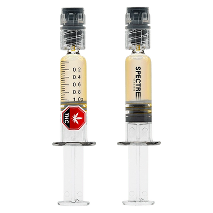 Front-facing pair of syringes filled with amber oil labeled "Operation Orange Liquid Diamond Dabber" against a plain white background.