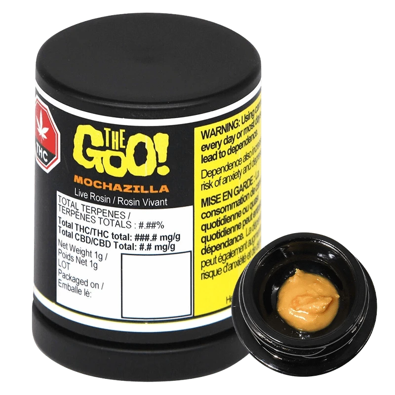 Angled studio shot of a black jar labeled "Mochazilla Live Rosin" with a small open container showing tan, glossy concentrate.
