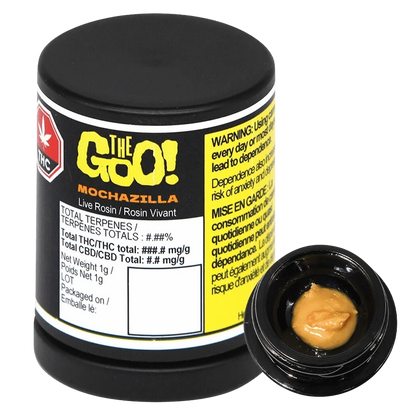 Angled studio shot of a black jar labeled "Mochazilla Live Rosin" with a small open container showing tan, glossy concentrate.