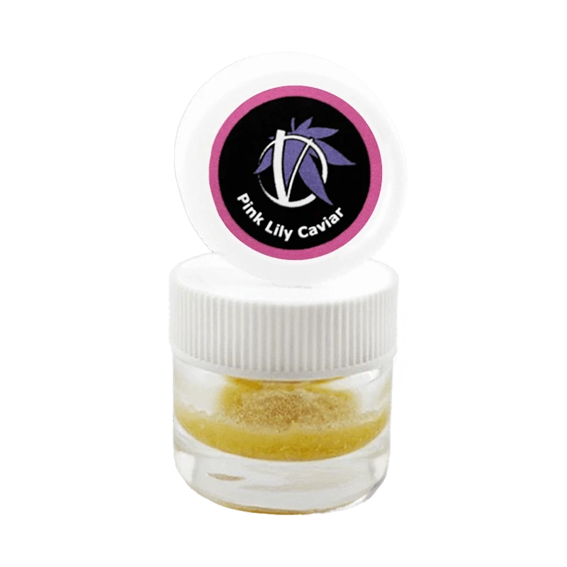Close-up front view of a small clear jar with a white ribbed lid and open cap showing the Pink Lily Caviar logo above a golden powder inside.