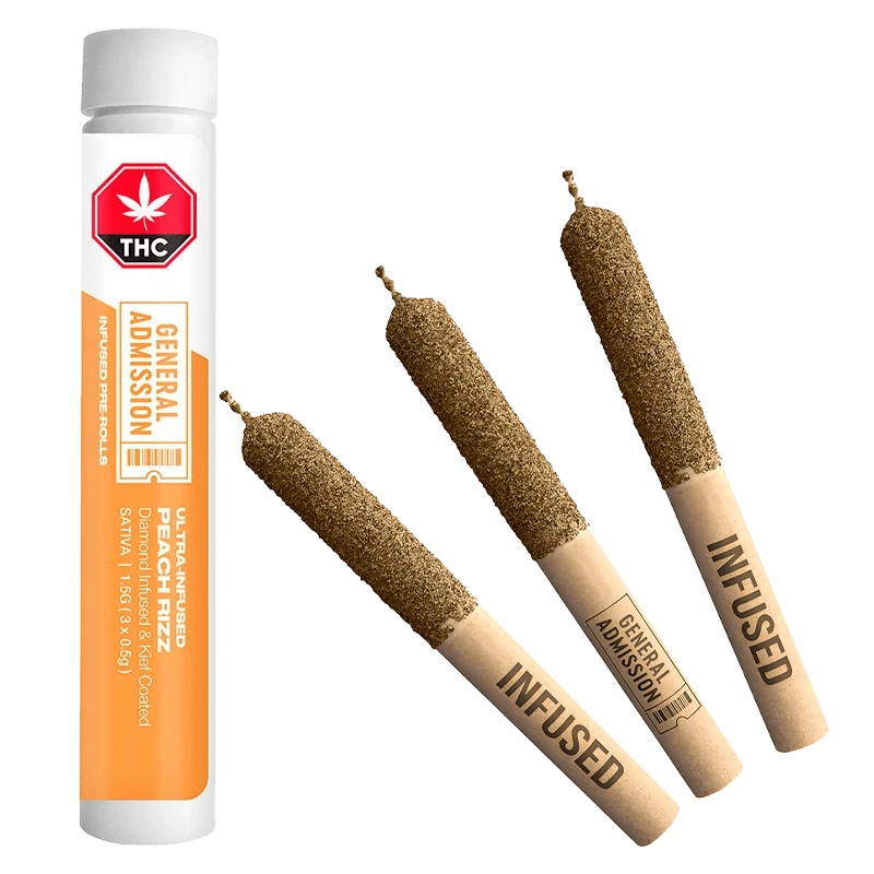Diagonal view of three diamond-coated pre-rolls and a standing white-orange tube of Peach Rizz Diamond Infused PR 3 x 0.5 g.