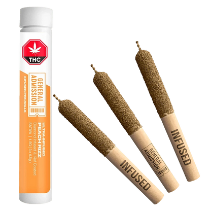 Diagonal view of three diamond-coated pre-rolls and a standing white-orange tube of Peach Rizz Diamond Infused PR 3 x 0.5 g.