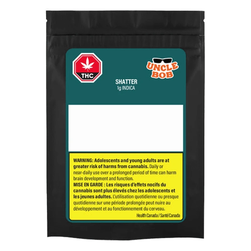 Front-facing black pouch labeled "Uncle Bob Indica Shatter" with teal header, empty white info panel and a yellow bilingual health warning block.