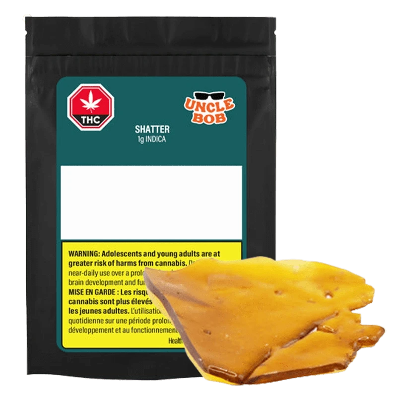 Front view of the Uncle Bob Indica Shatter 1 g package with a glossy amber-colored shatter piece resting in front.