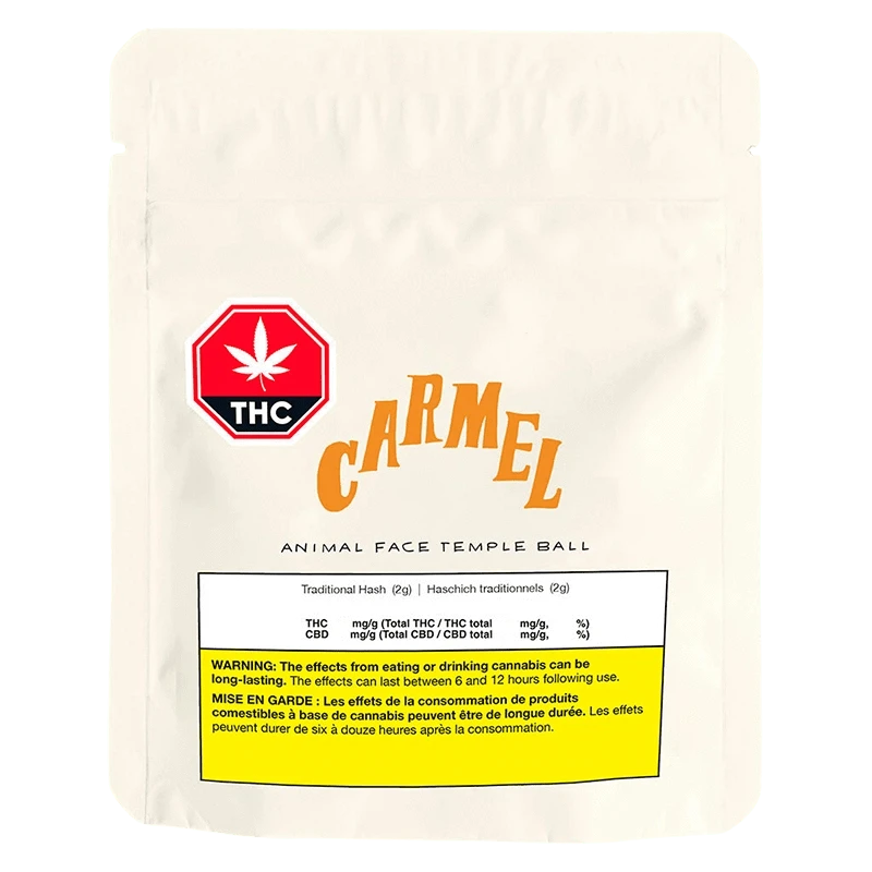 Front-facing pouch shot of a white Carmel Animal Face Temple Ball bag with a red THC badge and yellow warning panel.