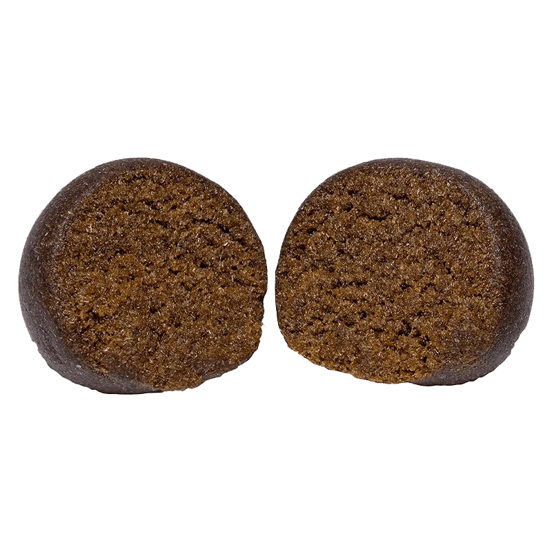 Close-up front view of two brown halves of an Animal Face Temple Ball set against a plain background.