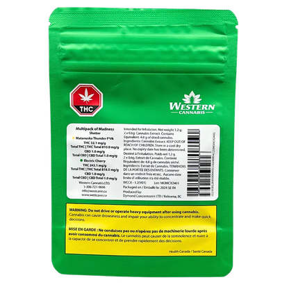 Rear view of the green Western Cannabis Orange Creamsicle Shatter pouch showing a white info label, THC symbol, and yellow warning panel.