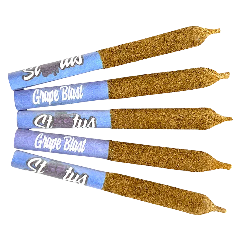 Angled top-down view of five Grape Blast Liquid Diamond Infused kief coated PR 5 x 0.25 g pre-rolls with blue grape-branded tips and textured kief coating.