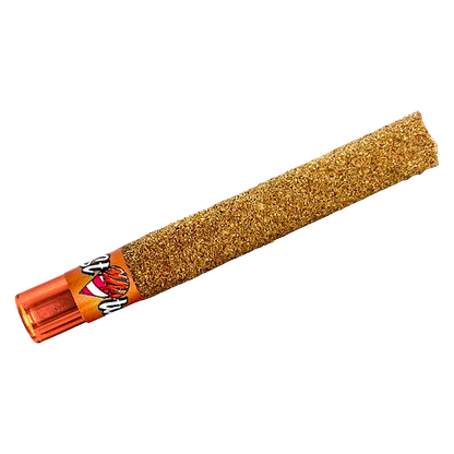 Diagonal close-up of a gold, kief-coated pre-roll with an orange tip, labeled "Tigers Bleed Liquid Diamond Infused kief coated PR 1 x 1 g" visible near the base.