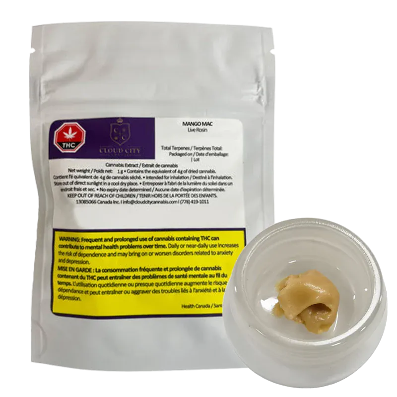 A white resealable pouch and a small clear jar photographed from a slight overhead angle showing the tan cannabis concentrate next to the pouch labeled Mango Mac Live Rosin.