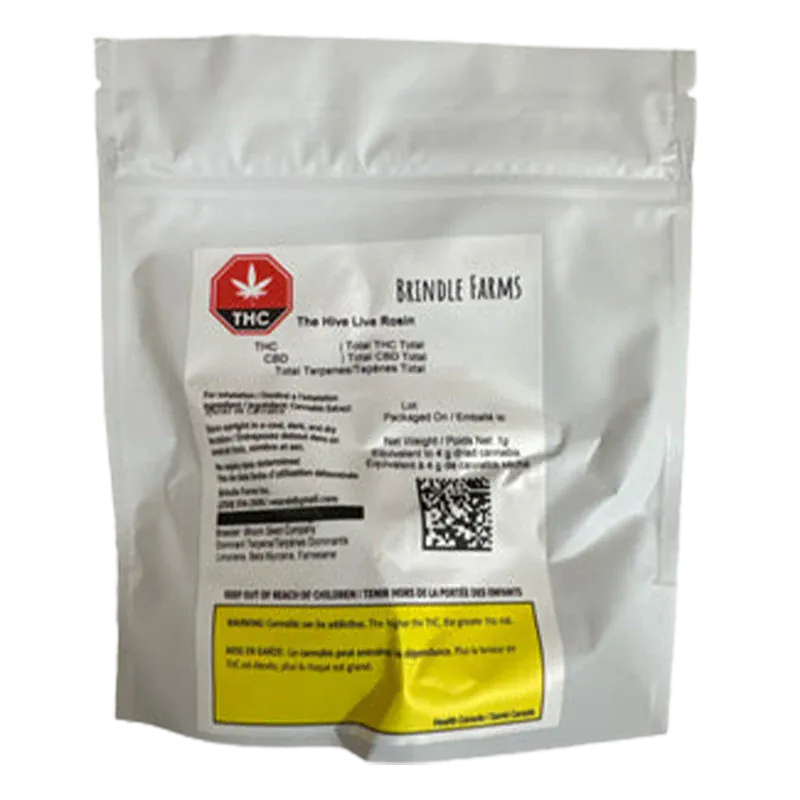 Front-facing shot of a white foil pouch labeled "Brindle Farms The Hive Live Rosin" with a red THC symbol and a yellow warning box near the bottom.