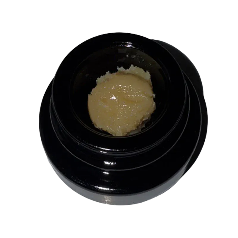 Top-down view of a black jar containing a pale, creamy concentrate labeled The Hive Live Rosin.