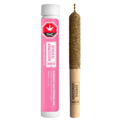 Vertical product shot of a pink tube and matching pre-roll showing the Cherry Watermelon Infused PR 1 x 1 g with a cork-tipped, kief-coated joint beside its labeled pink plastic tube.