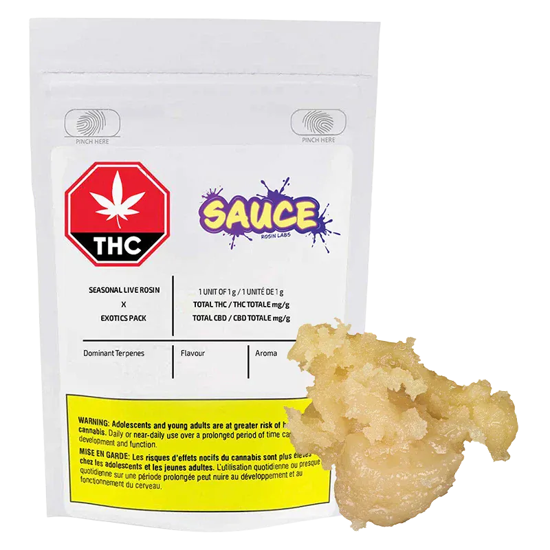 Front-facing shot of a white pouch and a pale golden dab, labeled "Seasonal Exotics Pack Live Rosin" with a red THC symbol and colorful "SAUCE" logo.