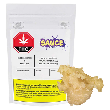 Front-facing shot of a white pouch and a pale golden dab, labeled "Seasonal Exotics Pack Live Rosin" with a red THC symbol and colorful "SAUCE" logo.