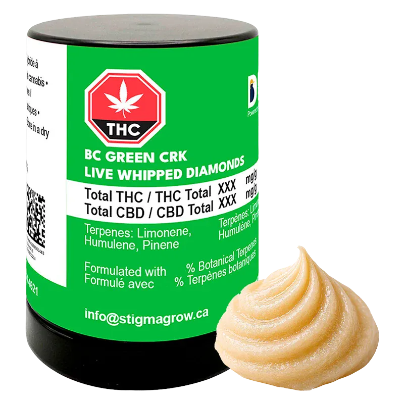 Angled front view of a green-labeled BC Green CRK Live Whipped Diamonds jar with a swirled beige concentrate beside it.