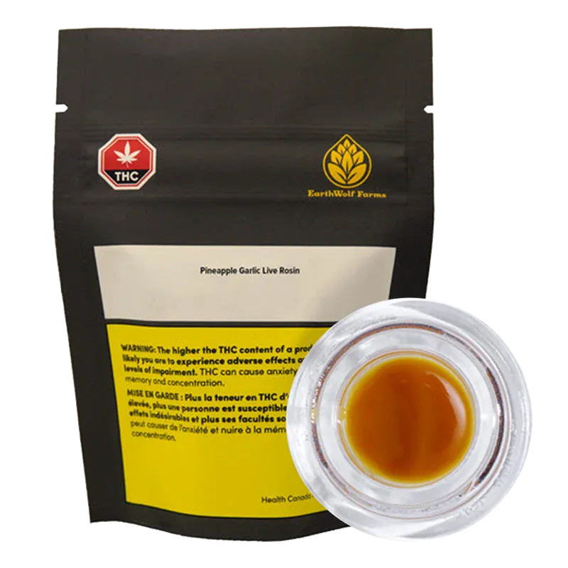Front view of a black pouch and a clear glass jar showing amber rosin, labeled "Pineapple Garlic Live Rosin" by EarthWolf Farms.